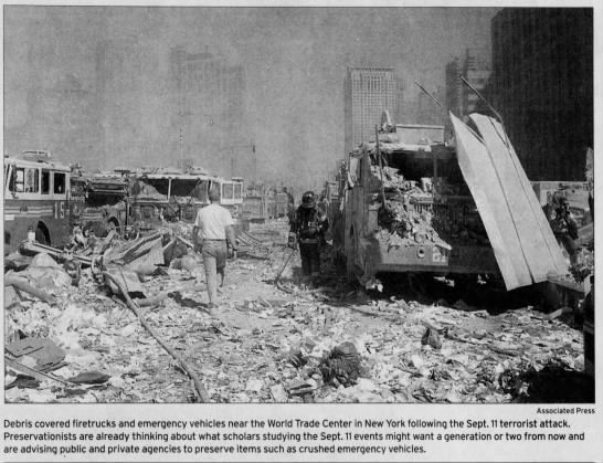 Debris covered firetrucks and emergency vehicles